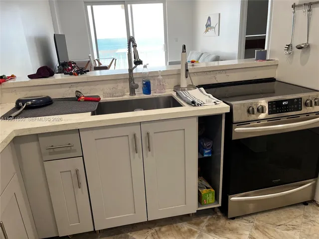 a kitchen with sink and window