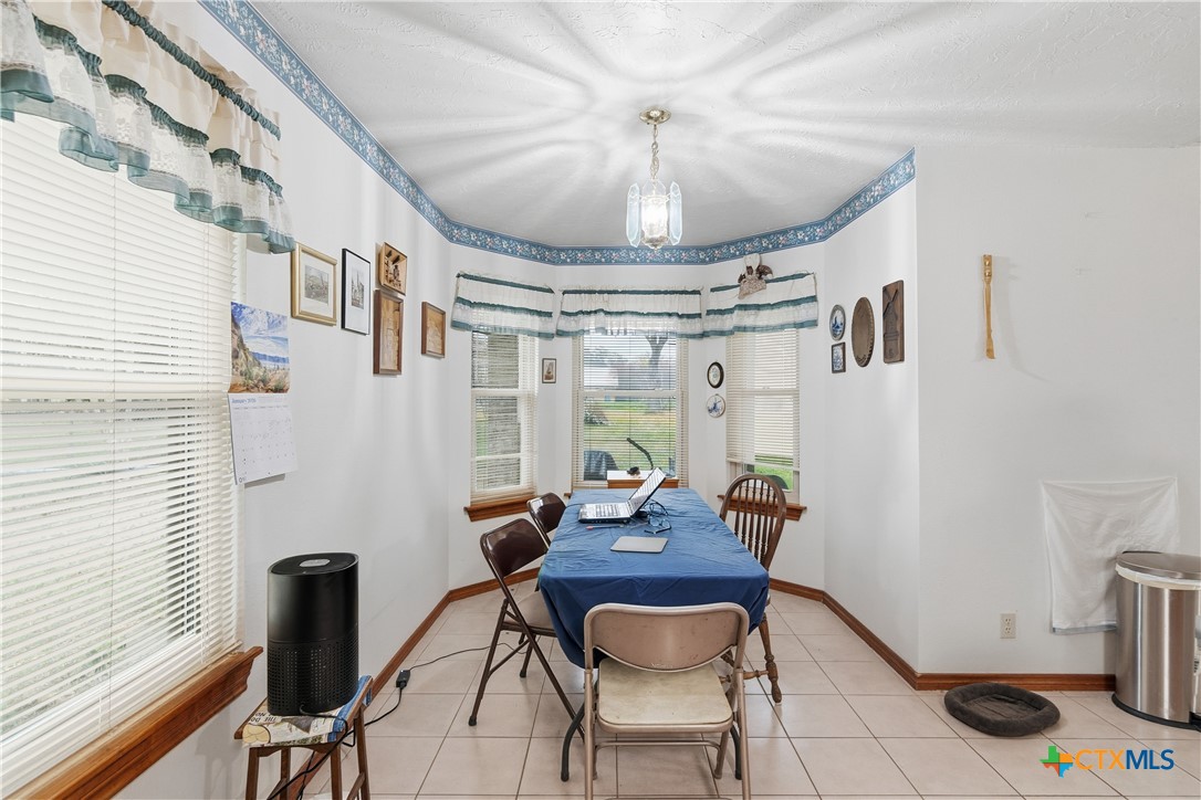 127 Santa Fe Ridge Seguin, TX 78155 - Photo 12 of 31 a view of a dining room with furniture and a window