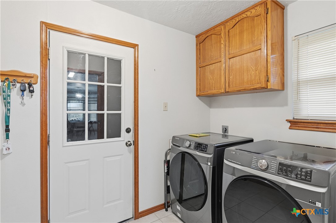 127 Santa Fe Ridge Seguin, TX 78155 - Photo 17 of 31 a utility room with dryer and washer