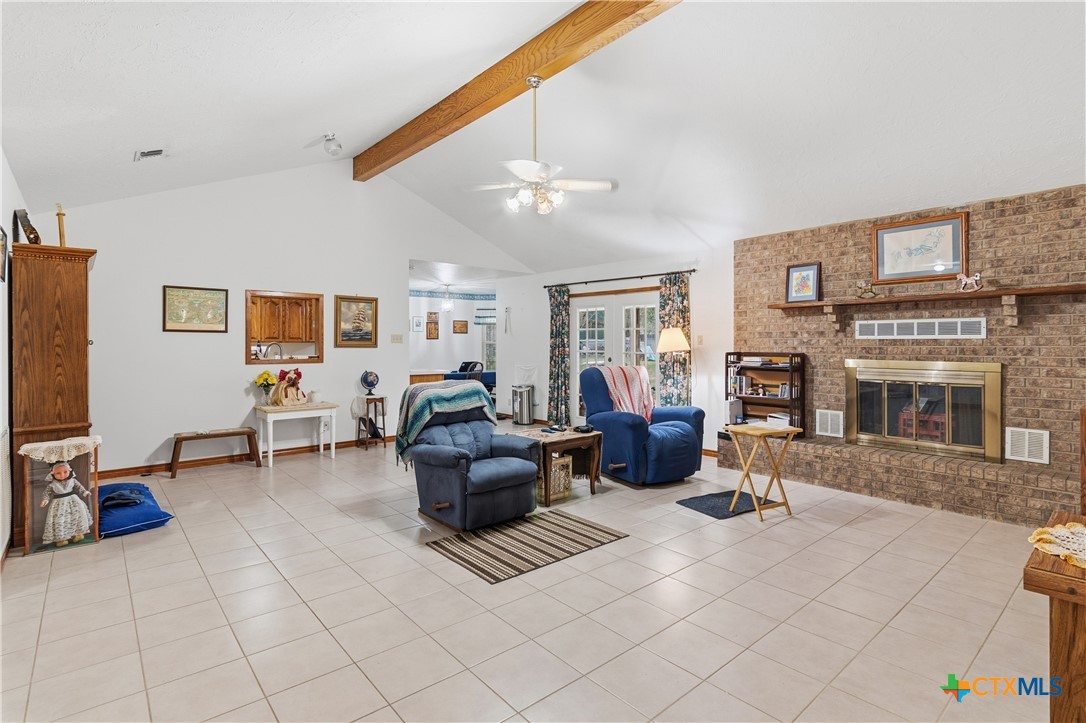 127 Santa Fe Ridge Seguin, TX 78155 - Photo 2 of 31 a living room with furniture gym equipment and a flat screen tv