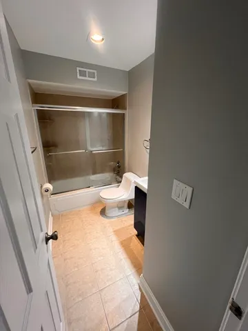 a bathroom with a bathtub and shower