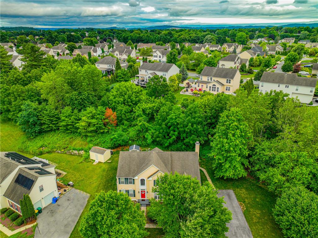138 Clover Hollow Road Easton, PA 18045 - Photo 90 of 95 An aerial perspective reveals a charming residential neighborhood enveloped by a lush, verdant landscape.