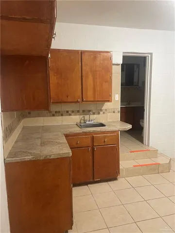 a bathroom with a sink vanity and mirror