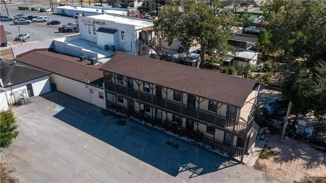 a view of a house with roof deck and sitting area
