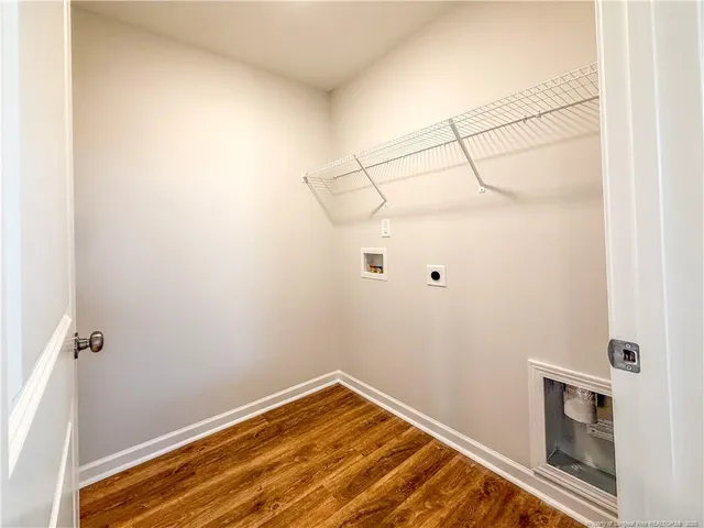 a view of an empty room and fire place