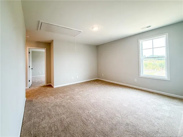 a spacious bathroom with a granite countertop sink and a mirror