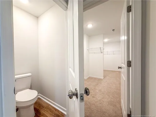 a view of a room with racks on the wall