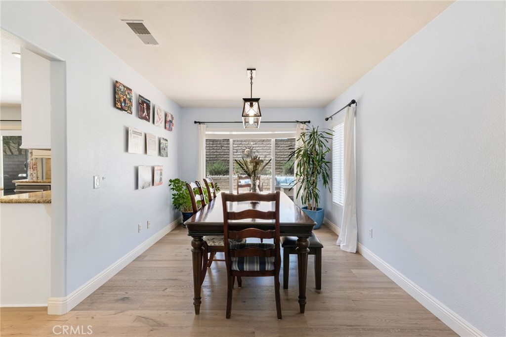3843 San Gabriel Street Simi Valley, CA 93063 - Photo 16 of 52 a dining room with furniture window and wooden floor