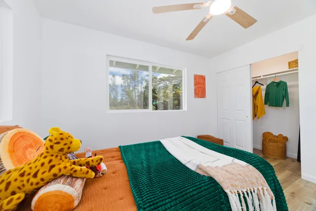 a bedroom with bed and a window