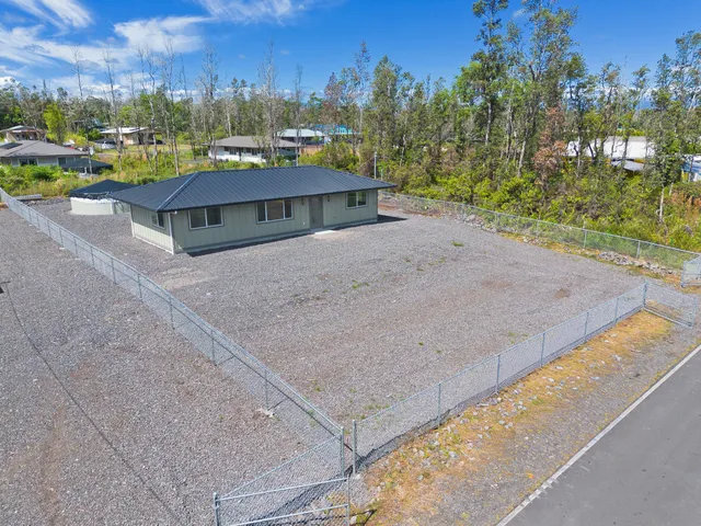 a view of a big yard with potted plants