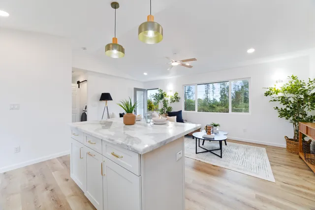 a view of a center island and living room