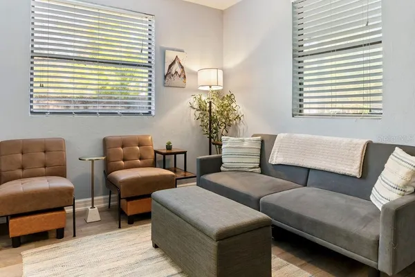 a living room with furniture and a window