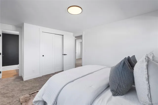 a bedroom with a bed and a shower