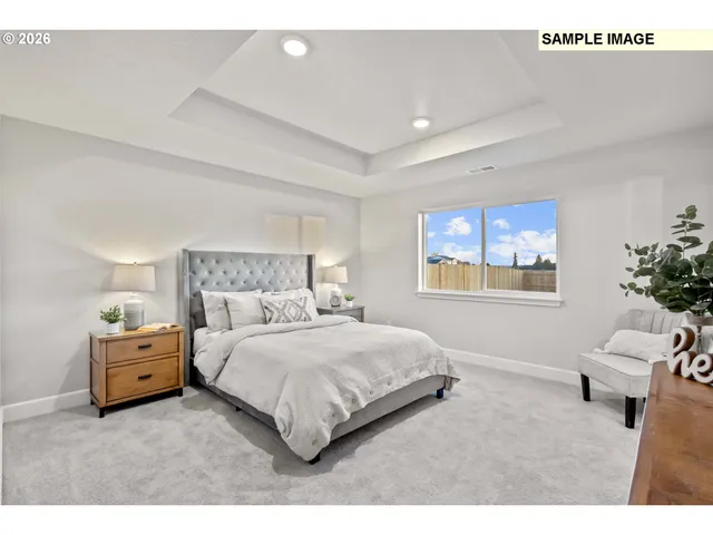 a bedroom with a bed and a couch