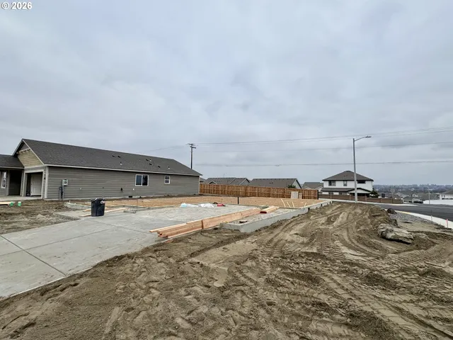 a view of a swimming pool with a yard