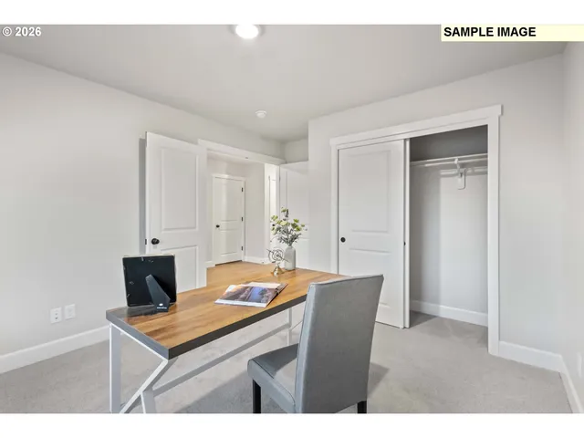 a dining room with a table and chairs