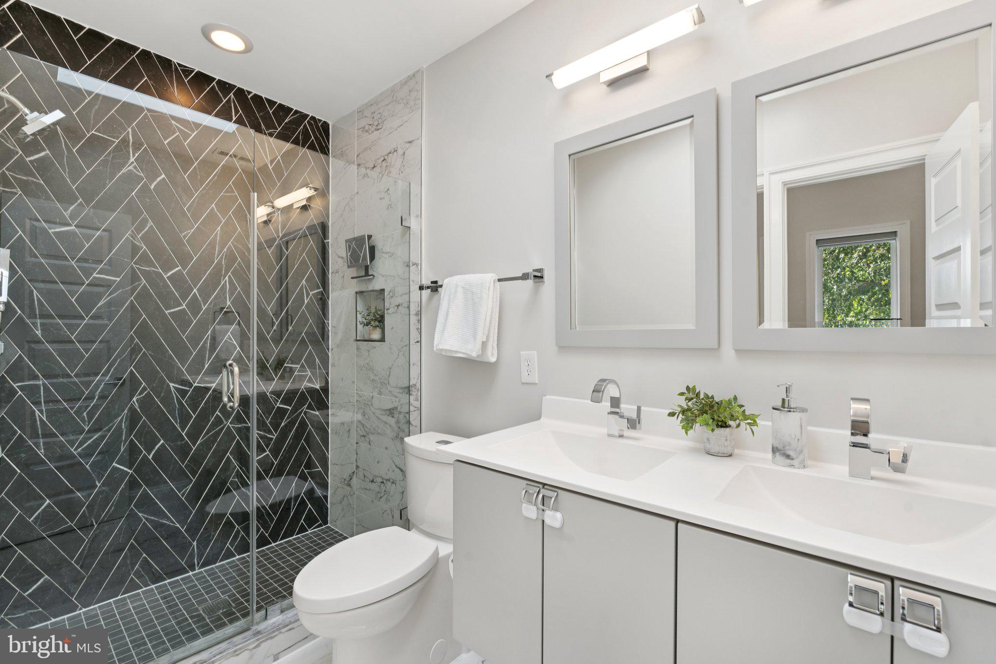 929 Quincy Street Northwest Washington, DC 20011 - Photo 19 of 37 a bathroom with a sink toilet and shower