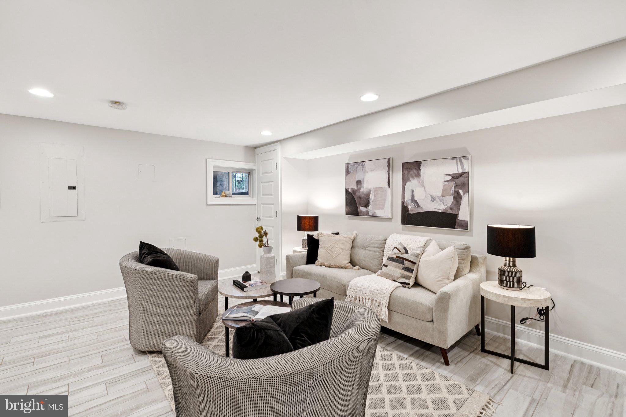 929 Quincy Street Northwest Washington, DC 20011 - Photo 23 of 37 a living room with furniture and a flat screen tv