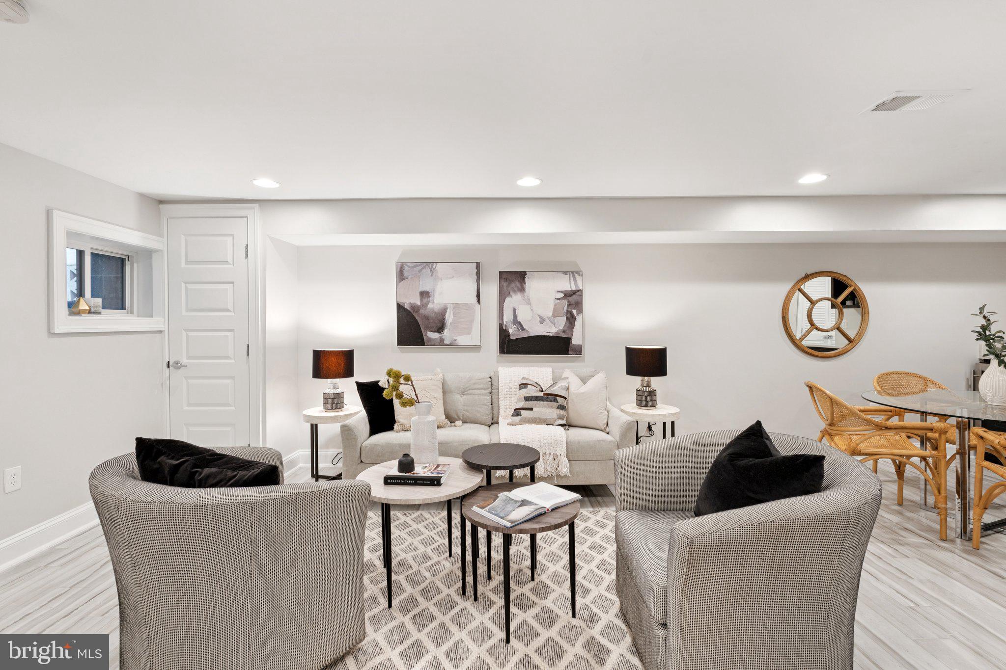 929 Quincy Street Northwest Washington, DC 20011 - Photo 24 of 37 a living room with couches a couch and a stove with wooden floor