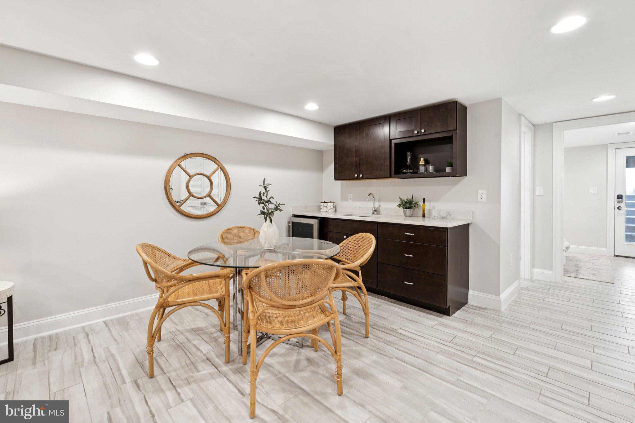 929 Quincy Street Northwest Washington, DC 20011 - Photo 27 of 37 a living room with furniture and a flat screen tv