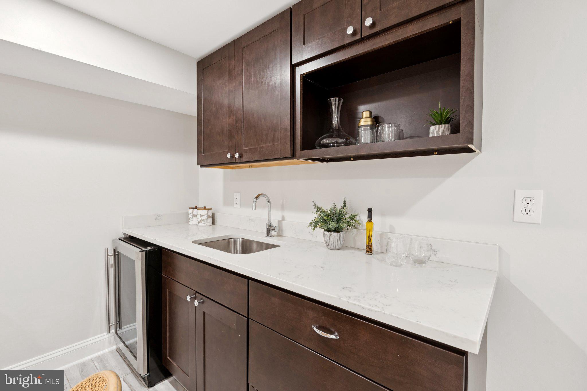 929 Quincy Street Northwest Washington, DC 20011 - Photo 29 of 37 a bathroom with a sink and a mirror