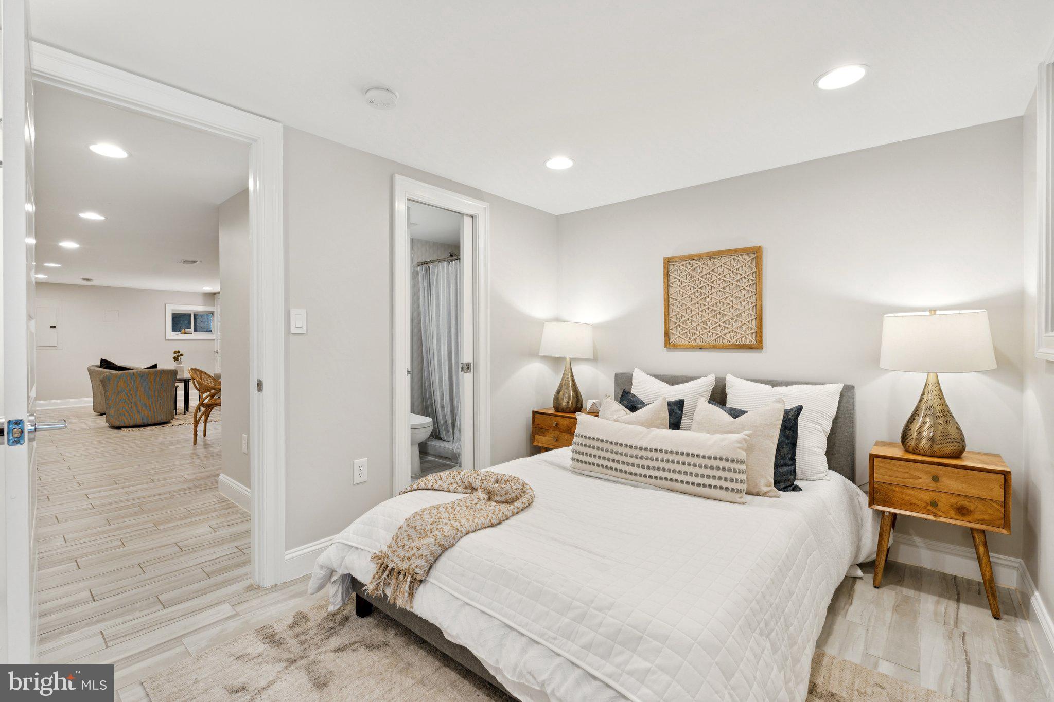 929 Quincy Street Northwest Washington, DC 20011 - Photo 30 of 37 a bedroom with a bed and a lamp