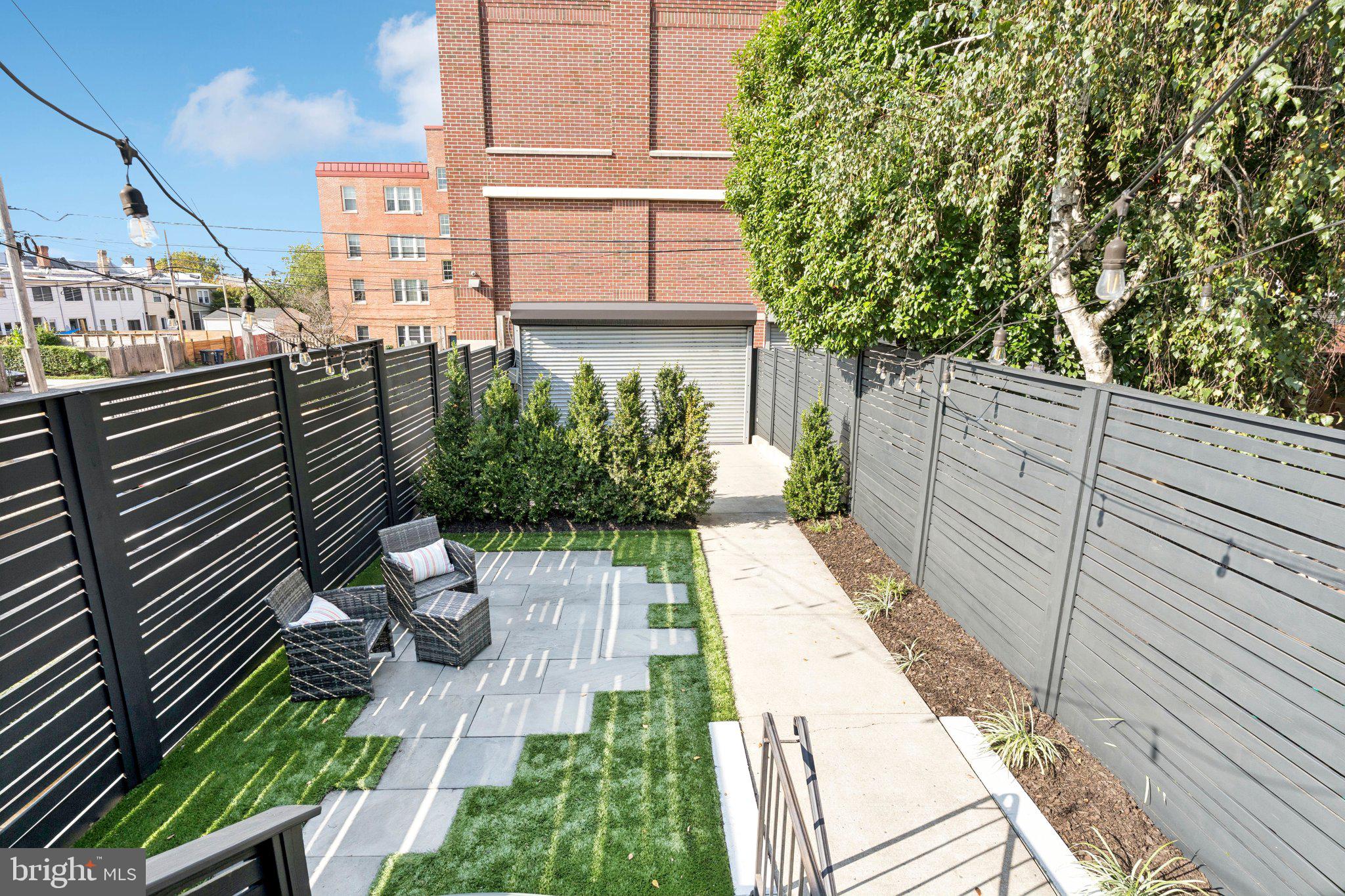 929 Quincy Street Northwest Washington, DC 20011 - Photo 34 of 37 a view of a backyard with sitting area