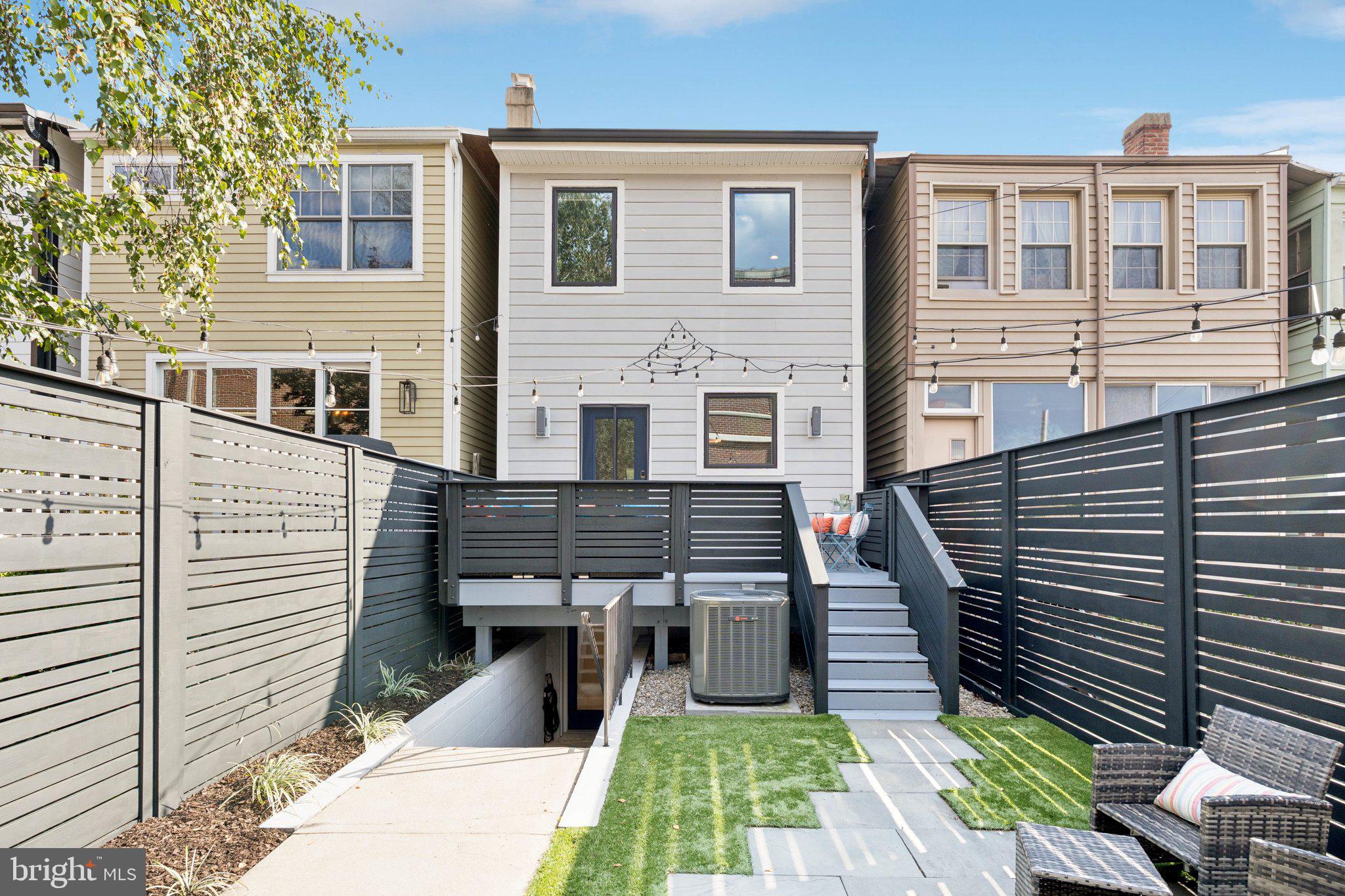 929 Quincy Street Northwest Washington, DC 20011 - Photo 35 of 37 a front view of a house with garden