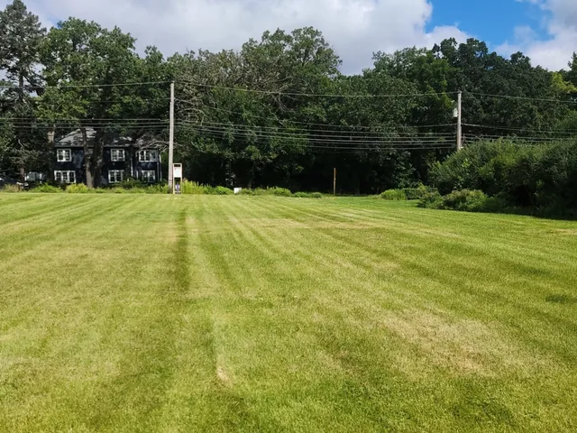 a backyard of a house with lots of green space