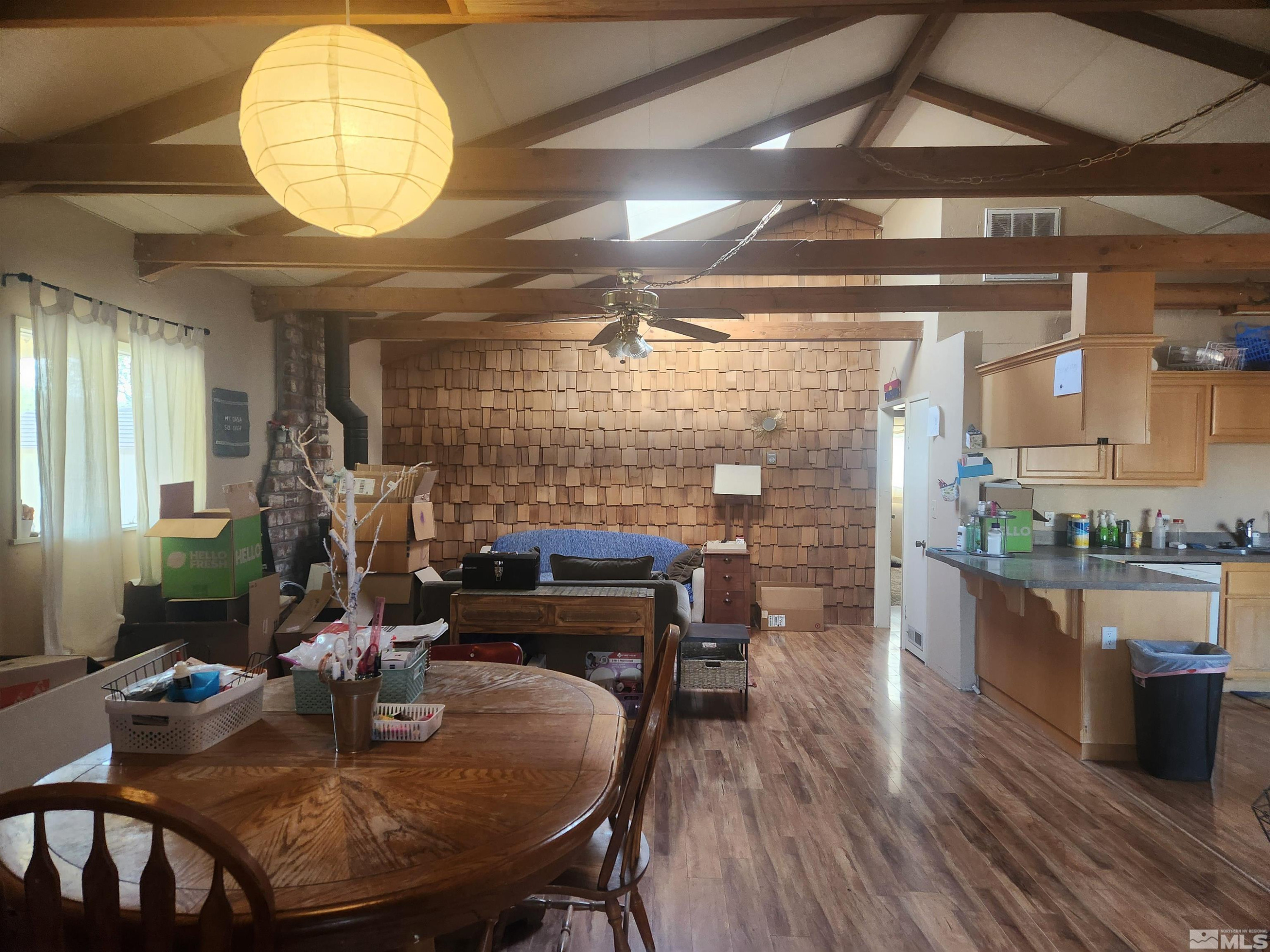 2703 Clapham Lane Minden, NV 89423 - Photo 2 of 6 a dining room with furniture and wooden floor