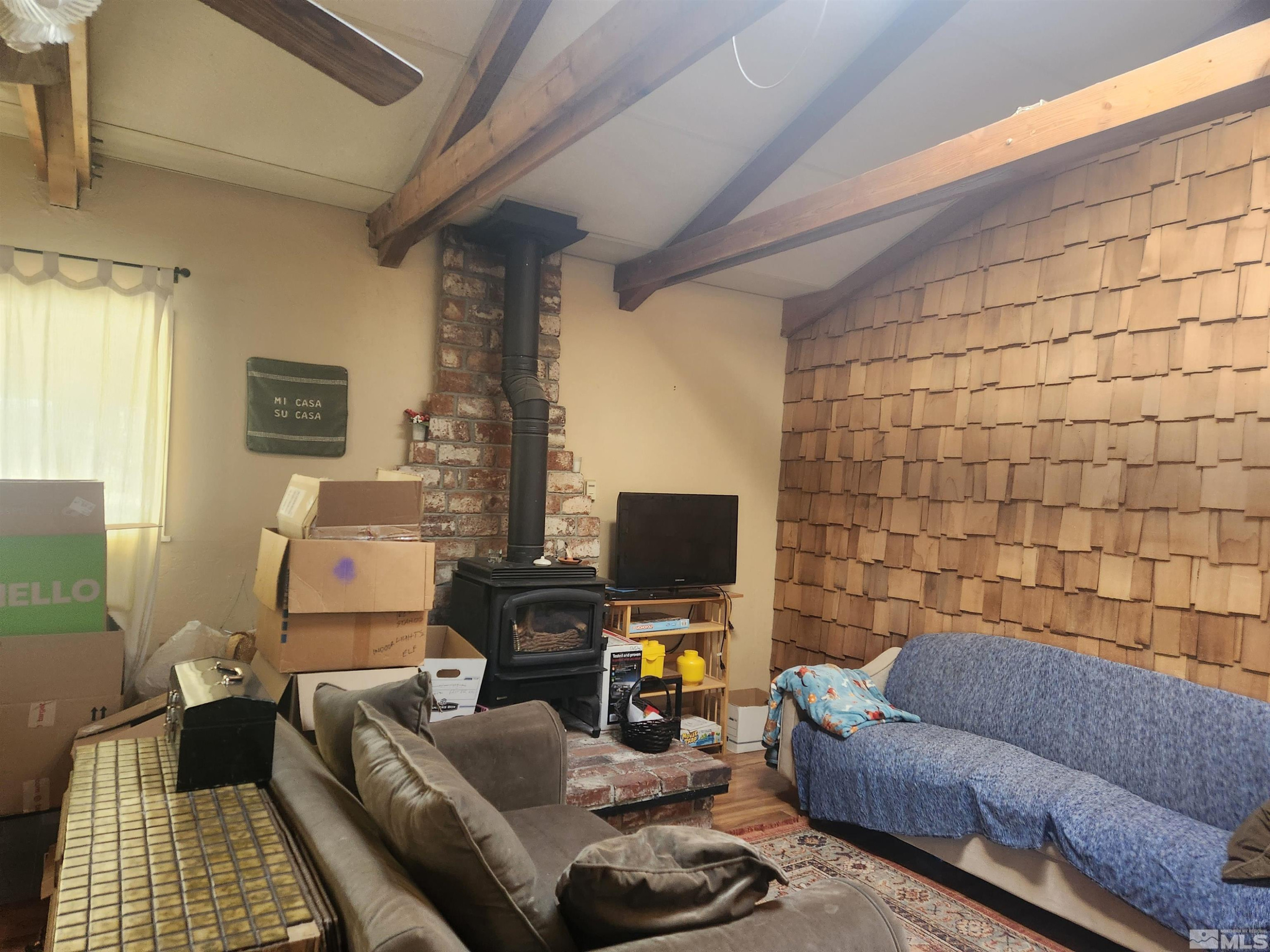 2703 Clapham Lane Minden, NV 89423 - Photo 3 of 6 a living room with furniture and a flat screen tv