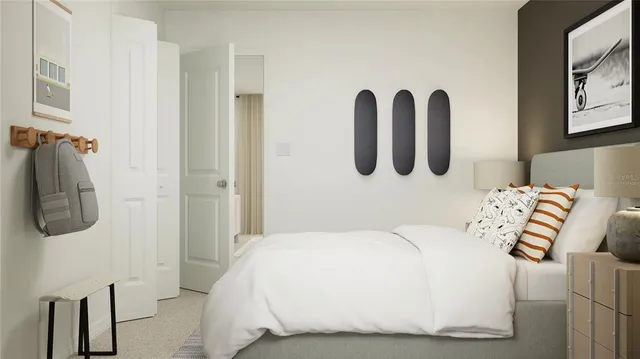 a bedroom with a bed and a wall painting