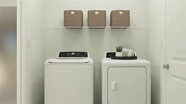 a utility room with dryer and washer