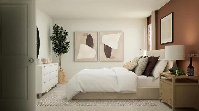 a bedroom with a large bed and a window