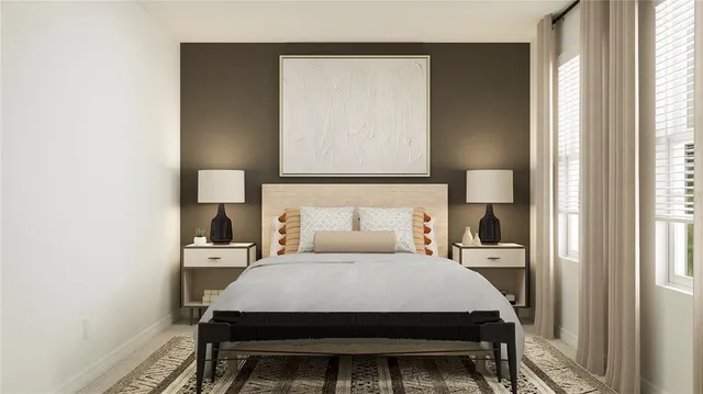 a bed sitting in a bedroom next to a window