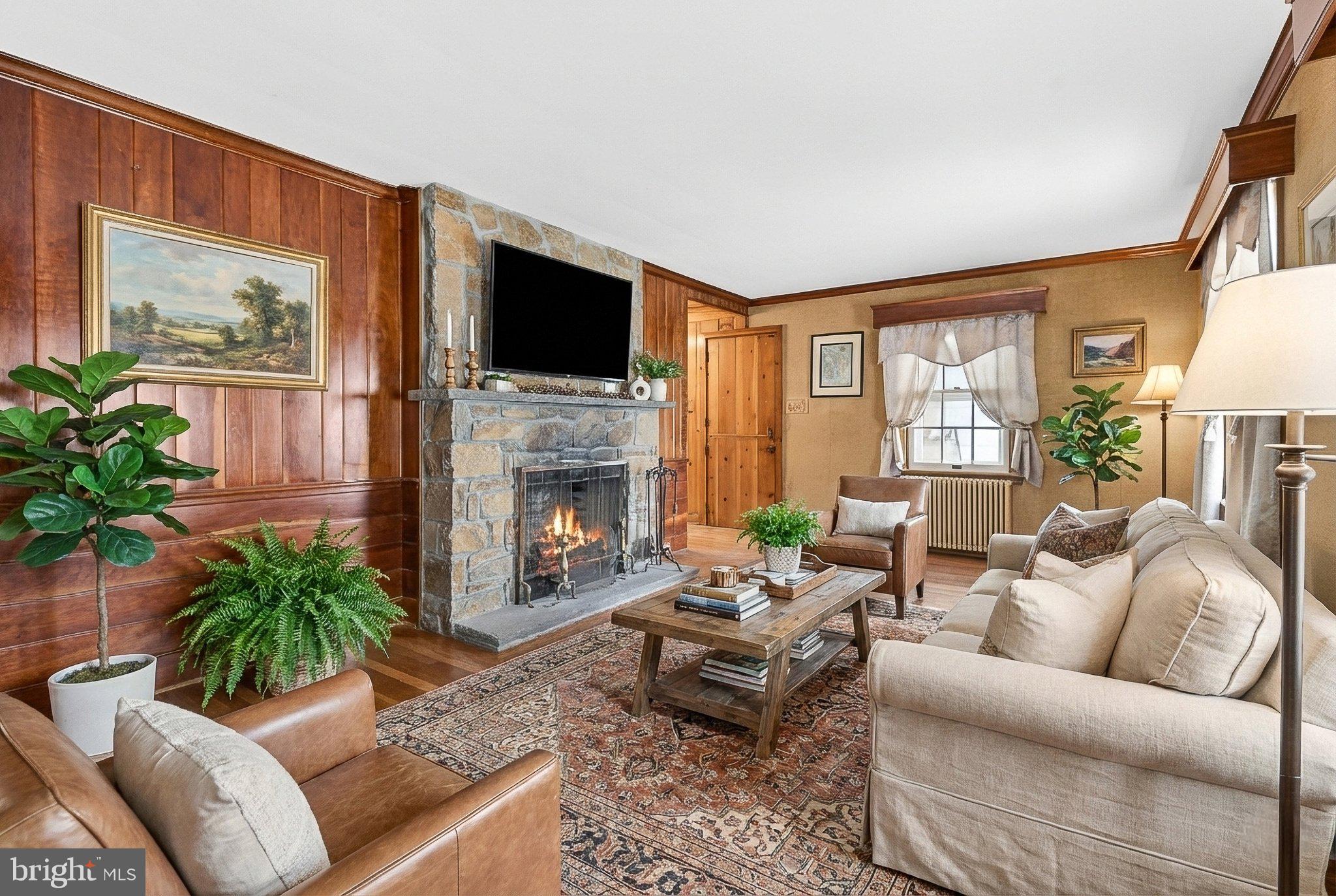 2009 Millstream Road Lancaster, PA 17602 - Photo 2 of 21 a living room with furniture a flat screen tv and a fireplace