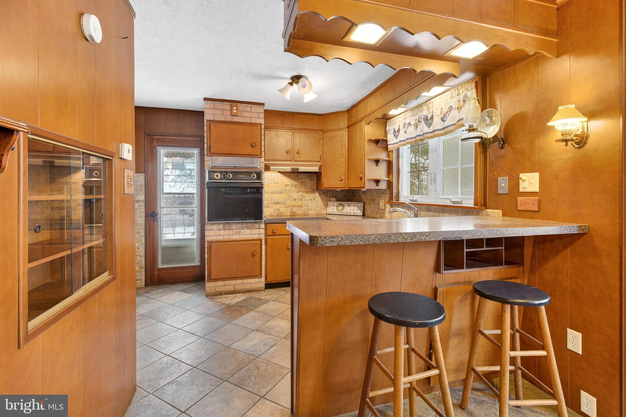 2009 Millstream Road Lancaster, PA 17602 - Photo 6 of 21 a kitchen with stainless steel appliances granite countertop a stove a sink and a refrigerator