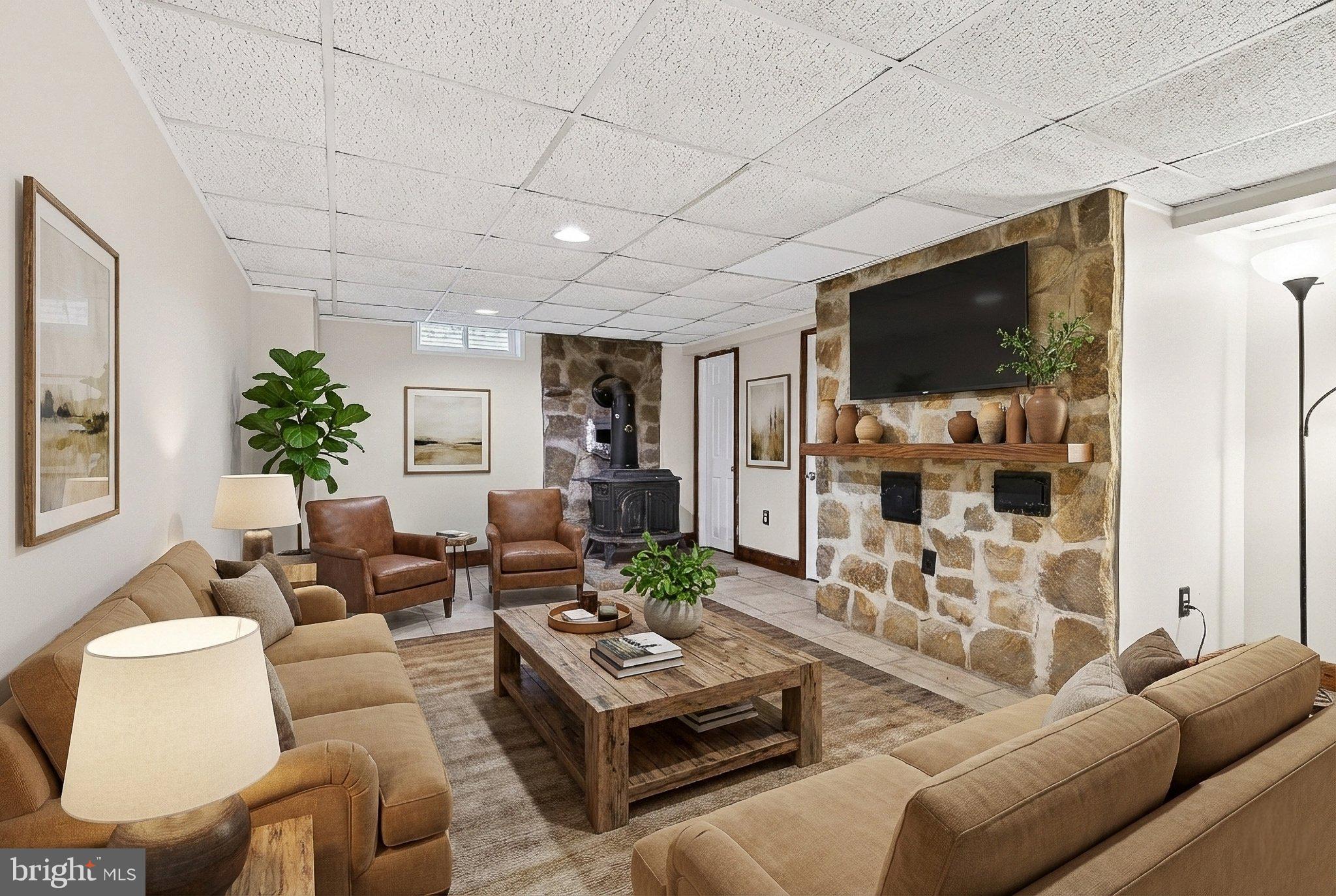 2009 Millstream Road Lancaster, PA 17602 - Photo 7 of 21 a living room with furniture a flat screen tv and a large window