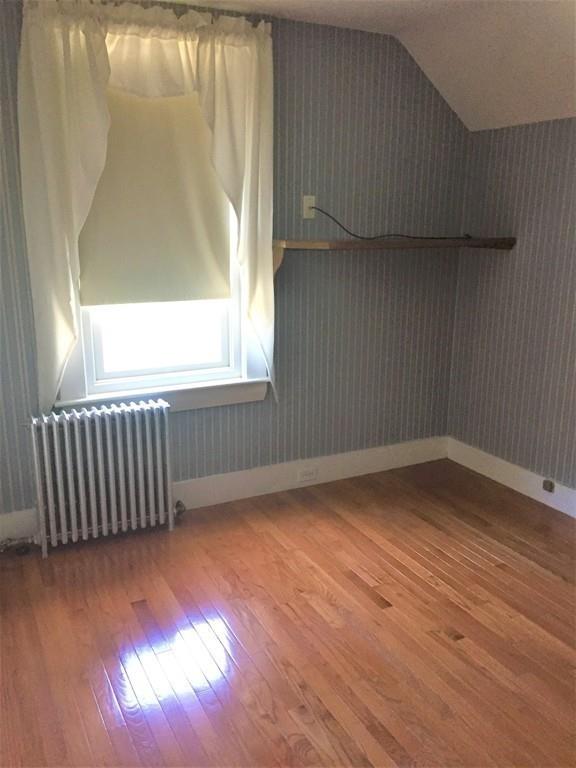 7 Argilla Road Ipswich, MA 01938 - Photo 15 of 20 a view of an empty room with wooden floor and a window