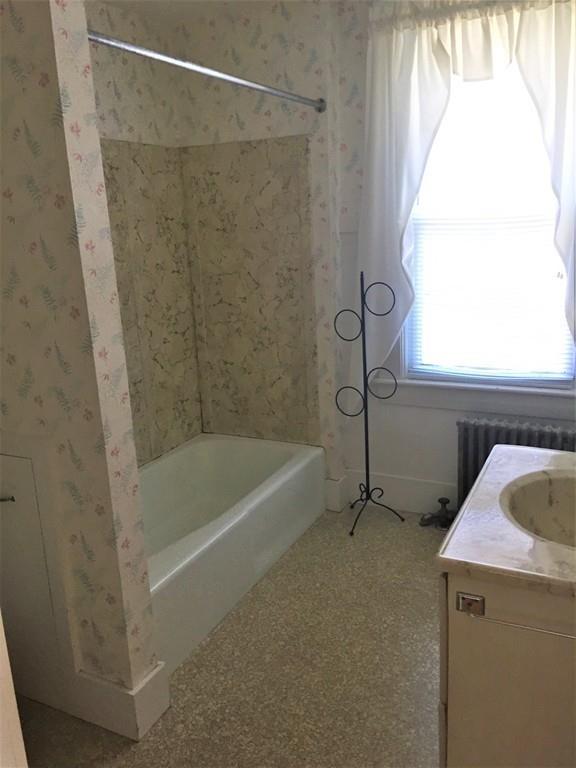 7 Argilla Road Ipswich, MA 01938 - Photo 17 of 20 a bathroom with a bath tub and a window