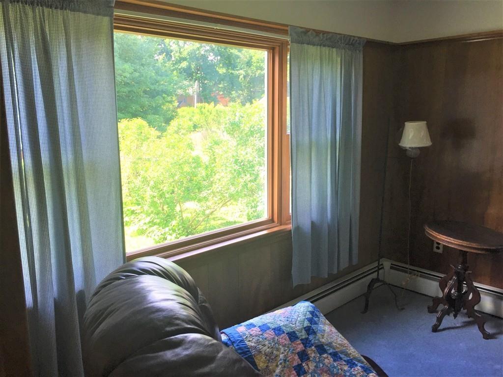 7 Argilla Road Ipswich, MA 01938 - Photo 18 of 20 a living room with a bed and a window