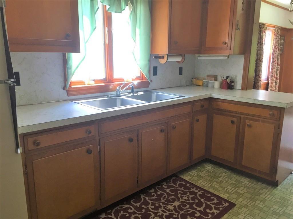 7 Argilla Road Ipswich, MA 01938 - Photo 9 of 20 a kitchen with a sink cabinets and window