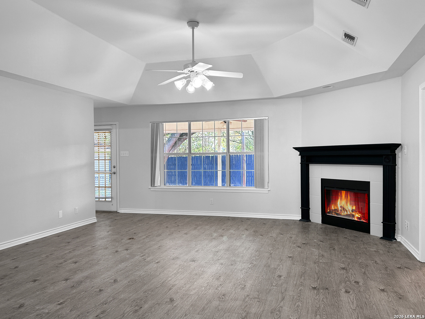 607 Topaz Avenue Seguin, TX 78155 - Photo 6 of 23 a view of an empty room with fireplace and a window