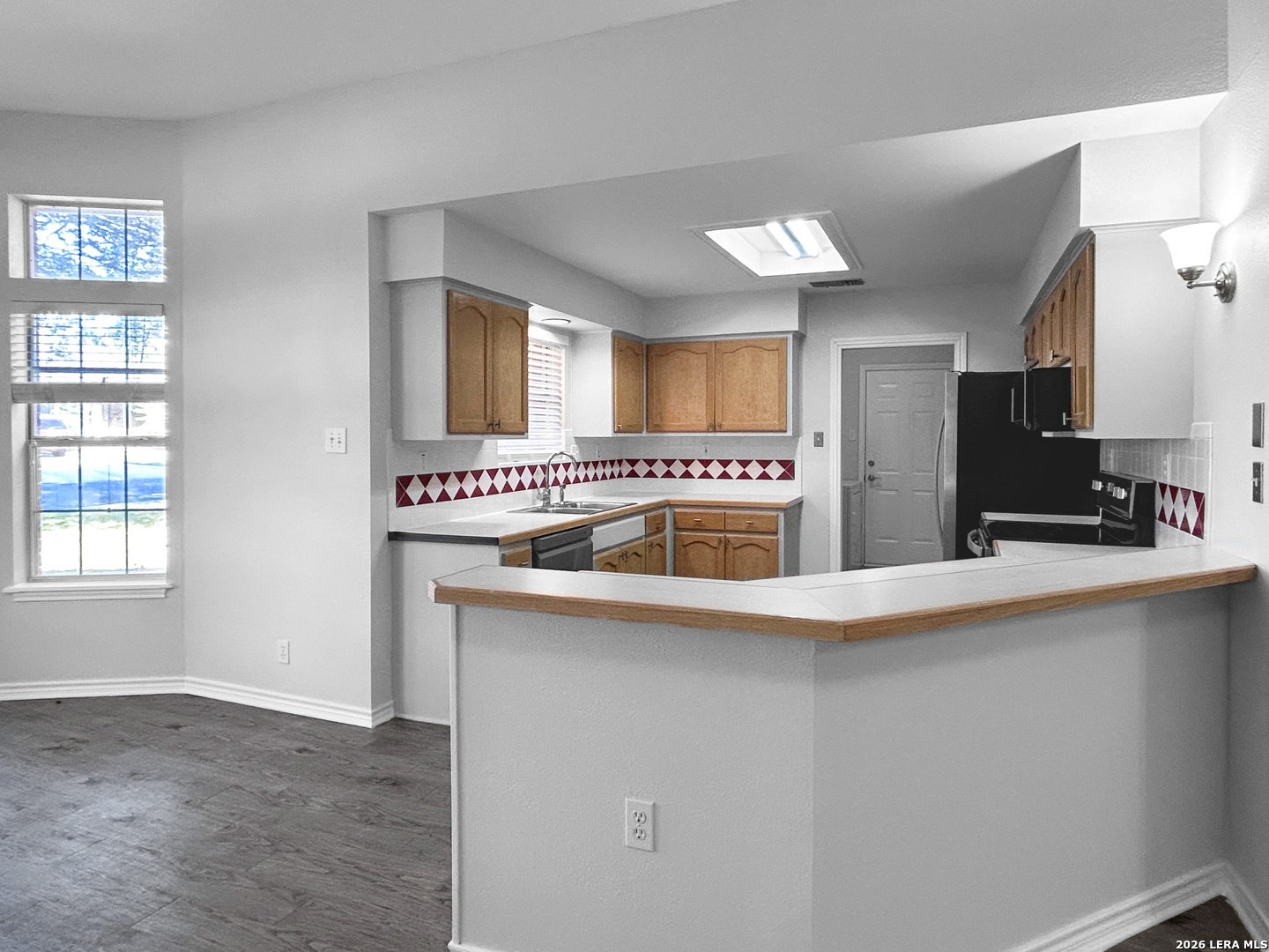 607 Topaz Avenue Seguin, TX 78155 - Photo 7 of 23 a kitchen with a sink a stove and cabinets