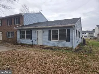 a house with trees in front of it