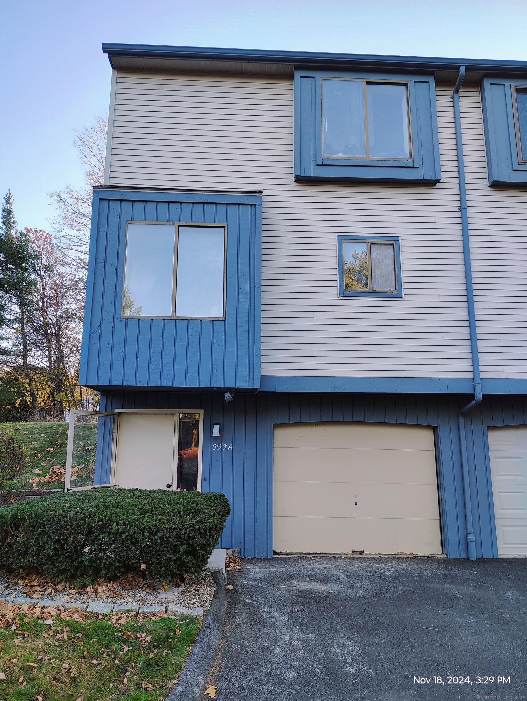592 East Center Street, Unit A Manchester, CT 06040 - Photo 1 of 1 a house with lots of trees in the background