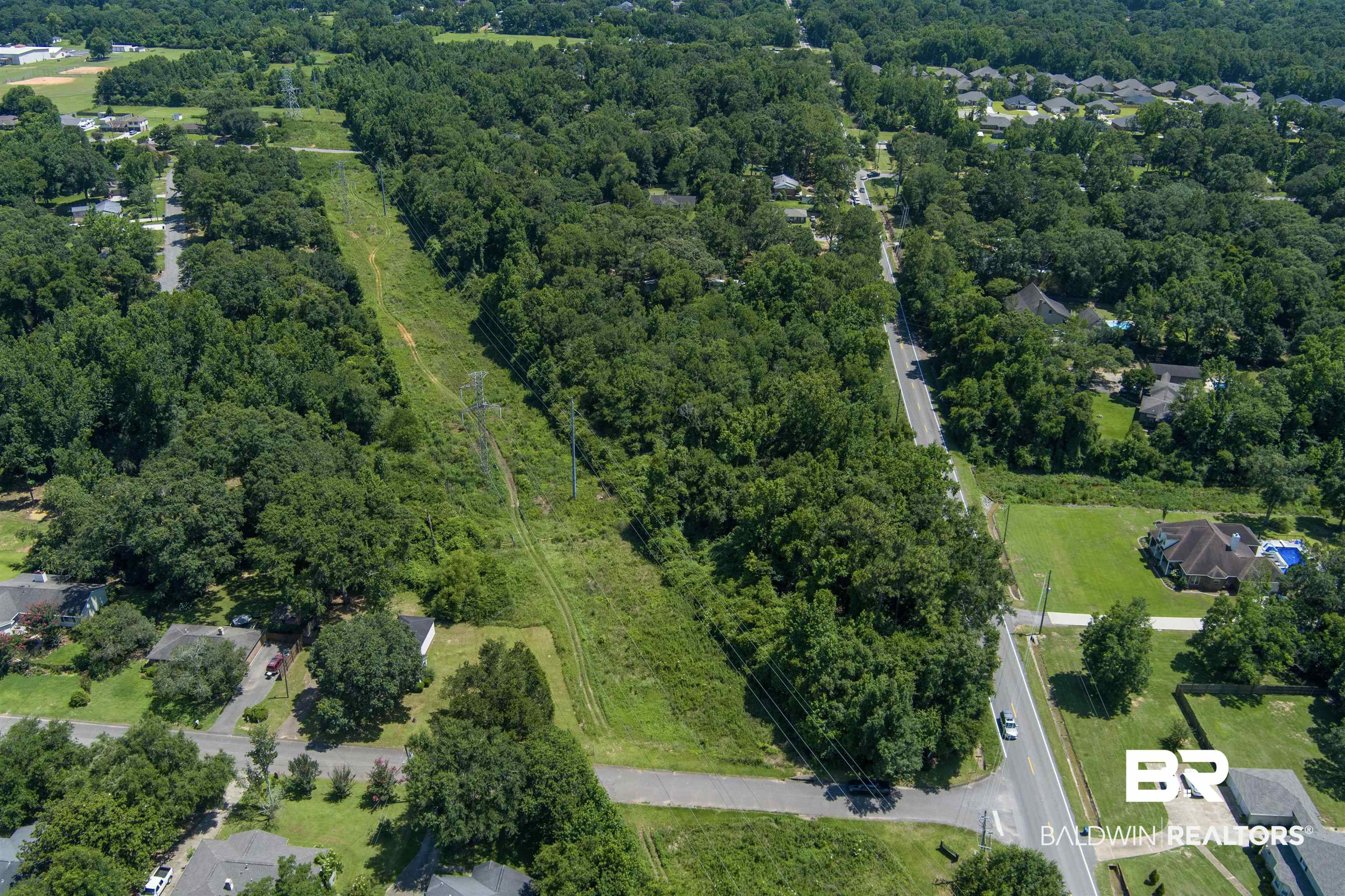 0 McFarland Road Mobile, AL 36695 - Photo 4 of 11 View of property location featuring a heavily wooded area