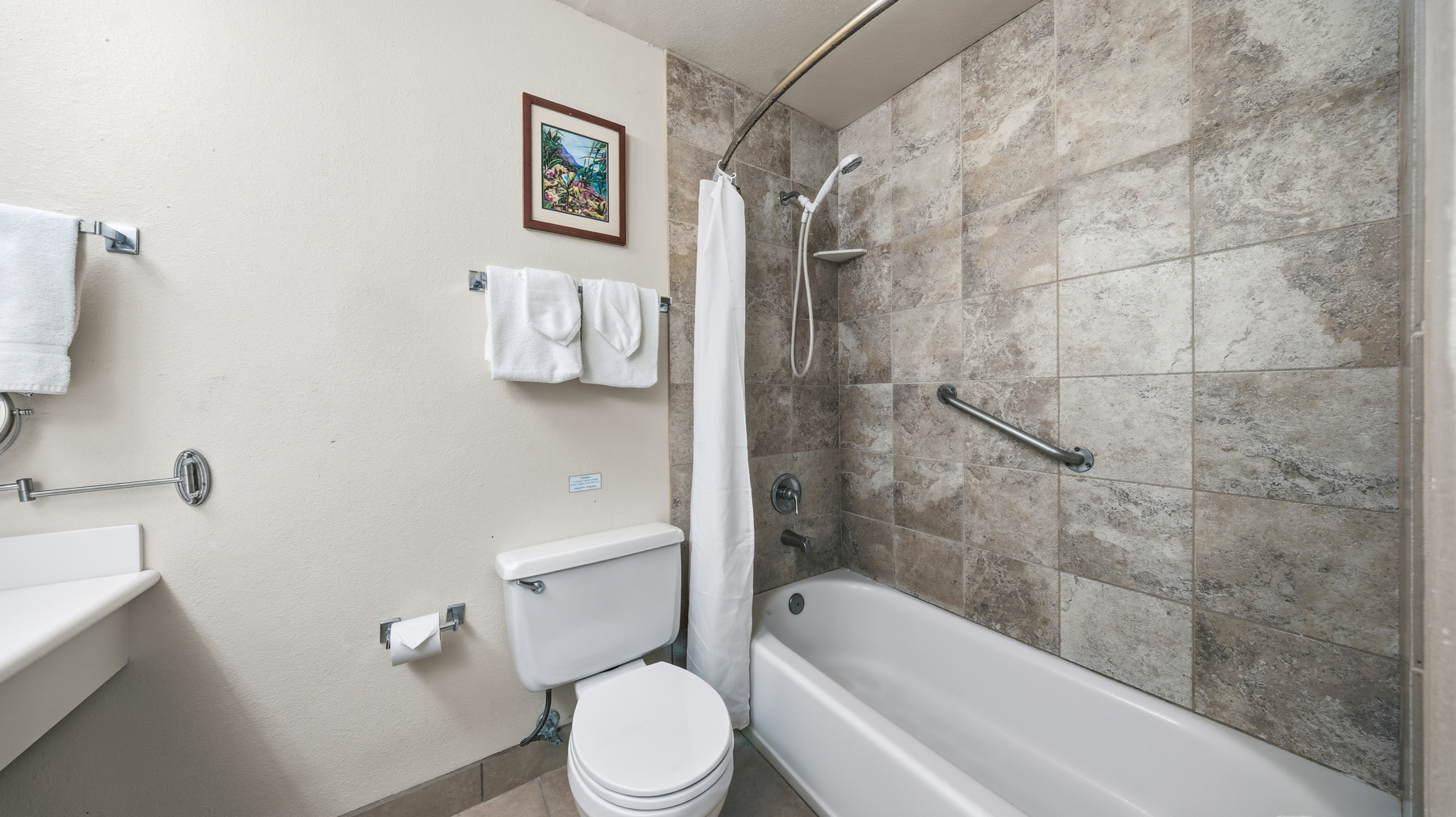 3411 Wilcox Road, Unit CV38 Lihue, HI 96766 - Photo 12 of 16 a white toilet sitting next to a bath tub and a shower