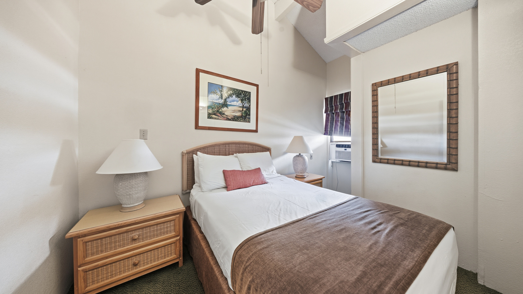 3411 Wilcox Road, Unit CV38 Lihue, HI 96766 - Photo 13 of 16 a bedroom with a bed and a lamp on table