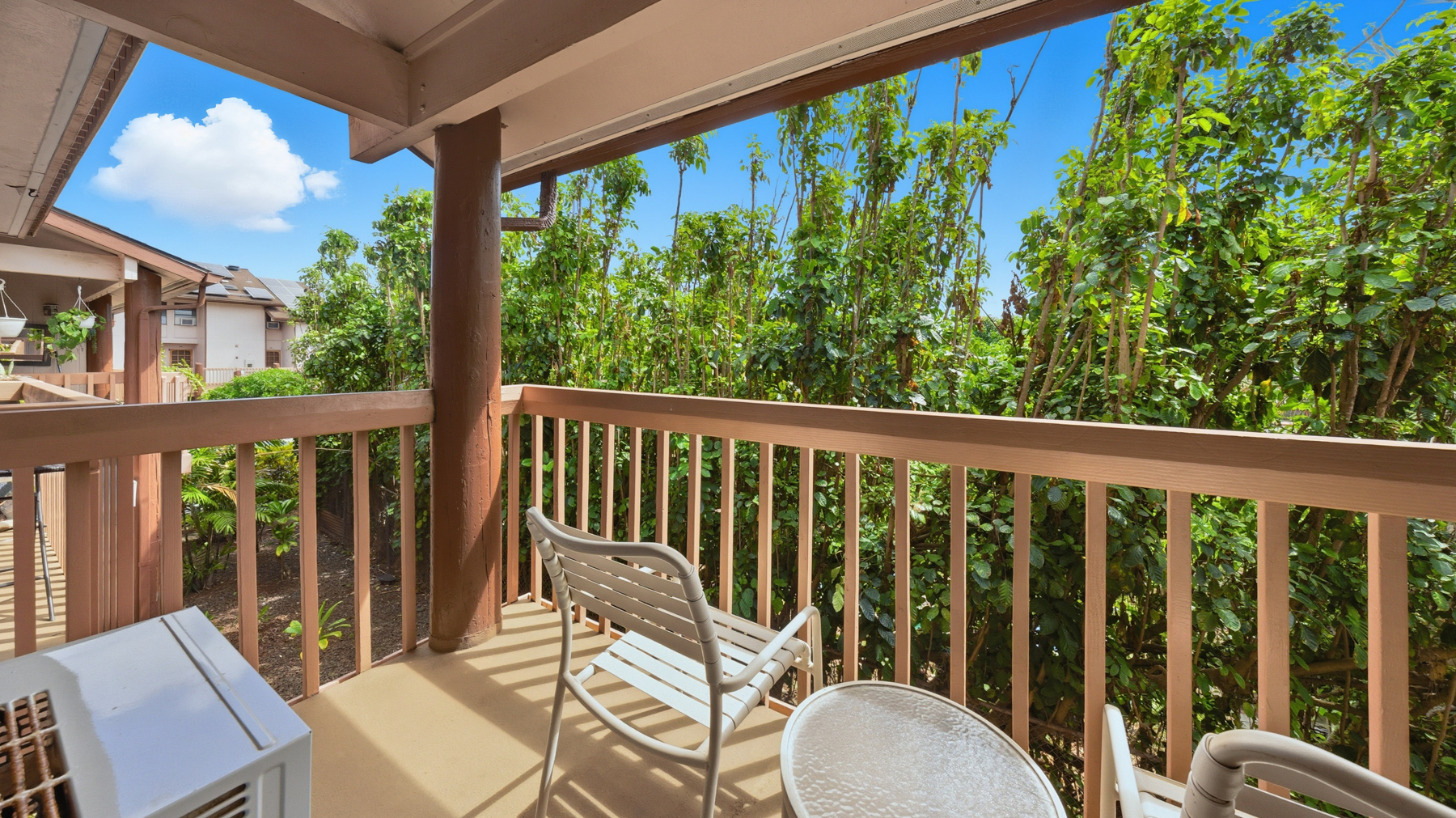 3411 Wilcox Road, Unit CV38 Lihue, HI 96766 - Photo 15 of 16 a view of a chair in wooden deck